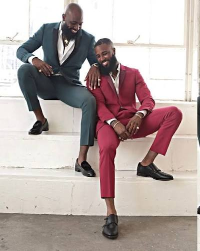 Distinct suit colors can make a group feel connected without making everybody look identical.